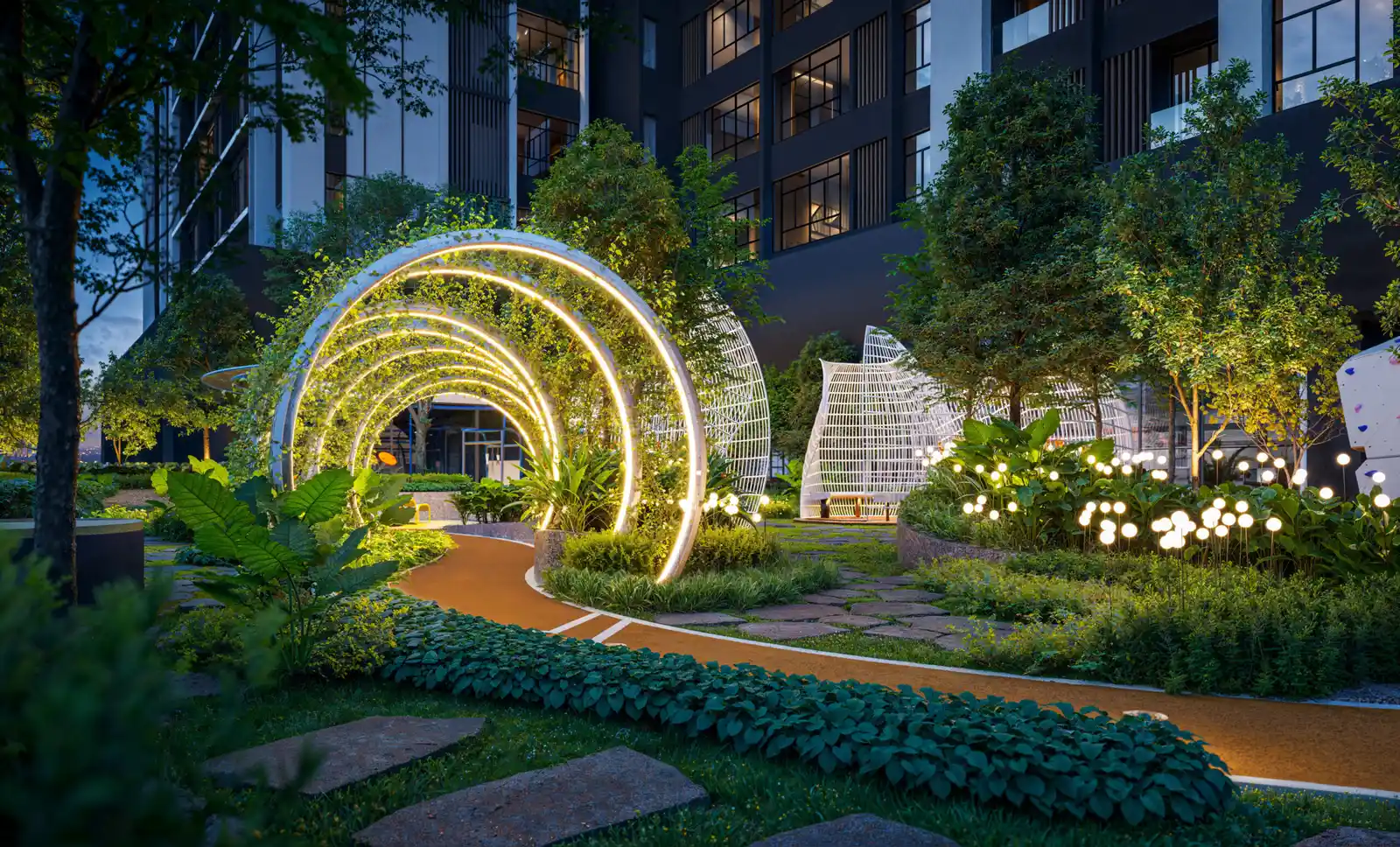 Illuminated circular arches over a landscaped evening jogging path at Gen Sphere, Johor Bahru